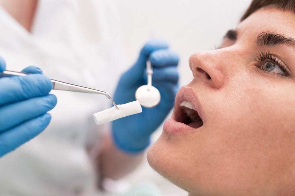 female patient having procedure done dentist