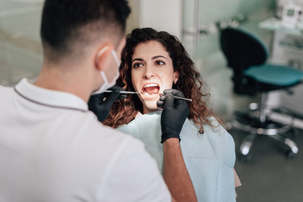 patient dentist office having check up